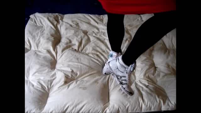 Jana tramples on duvet with different hi top sneaker trailer