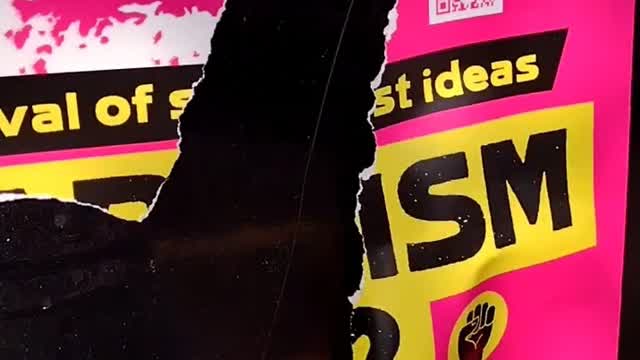 Tearing down Marxist posters