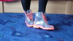 Jana shows her shiny transparent rubber booties with orange