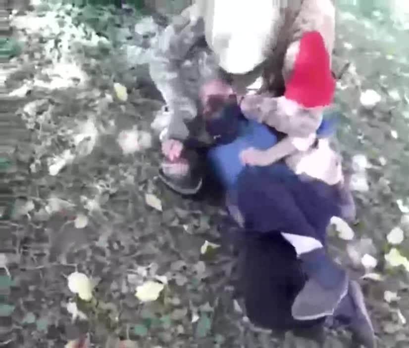 Ukranian Soldier tortures old man, slits throat