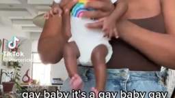 A dark-skinned mother demonstrated her child to the general public, calling him “gay.”