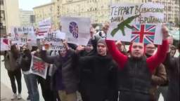 In Moscow, a crowd of Muscovites greeted British Ambassador Deborah Bronnert with posters near the F