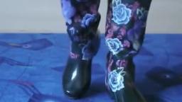 Jana shows her shiny black rubber boots with flowers