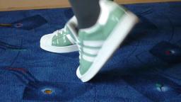 Jana shows her Adidas Superstars green, white