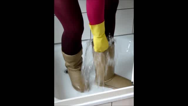 Jana wash and squeaky her beige UGG boots in shower trailer