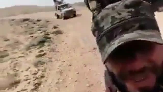 Technical in the background drives over an IED Technical in the background drives over an IED