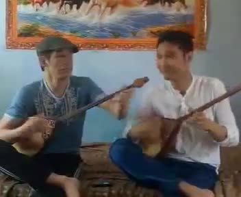 Two dudes playing Korogly (Көрөғлы) on the dombra