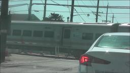 LIRR TRAIN PASSING LONG BEACH ROAD IN ISLAND PARK