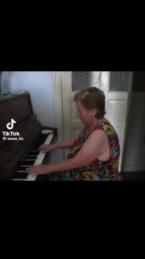 Old person playing piano