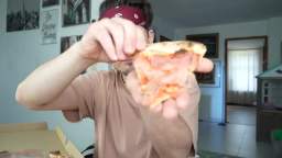 Vito Jim Harino Silvestri eats pizza with a ranch sauce