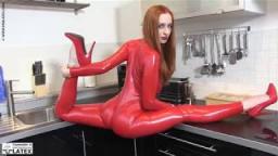 Flexible woman in Red Latex Catsuit