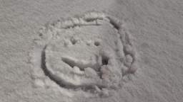Drawing a smiley face on the snowy trampoline - Recorded on November 28, 2022, at 6:32PM MT