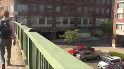 WALKING ACROSS A BRIDGE IN BOSTON