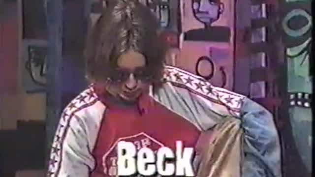 beck is asked a question about his name then he proceeds to turn around and throw a shoe.