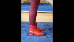 Jana shows her red heeled rubber booties
