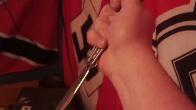National Socialist does a knife trick