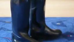 Jana shows her shiny black rubber riding boots with zipper