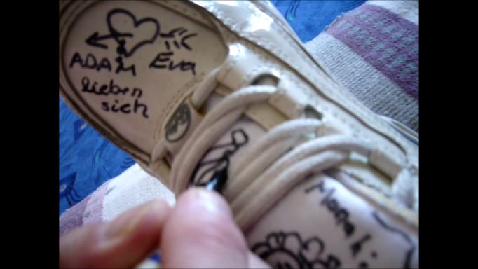 Janas friend painted and write on her shiny white Buffalo sneaker trailer