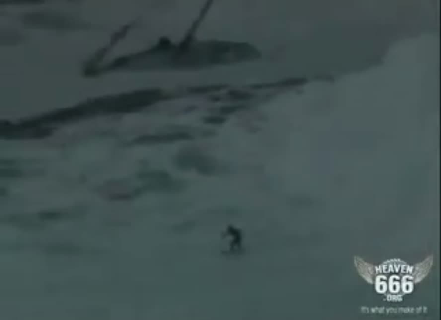 Man surfs giant wave during storm