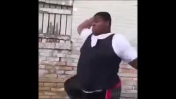 fat black man dances to dwarf music