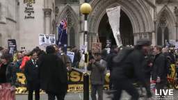 A rally in support of Assange takes place outside the High Court in London, which begins two days of