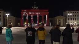 In Berlin that night, someone hacked the projection onto the Brandenburg Gate and reminded the Hans 