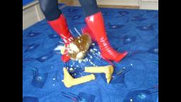 Jana destroyed with her red high heel patent leather boots a fabric chicken