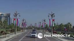 Camel cavalry against the backdrop of skyscrapers and Russian flags greets Putin in the Emirates.