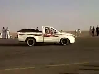 Toyota Hilux driving on two wheels