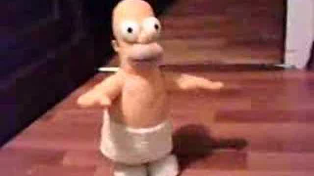 Homer Simpson cantando "Macho man"