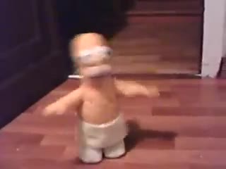 Homer Simpson cantando "Macho man"