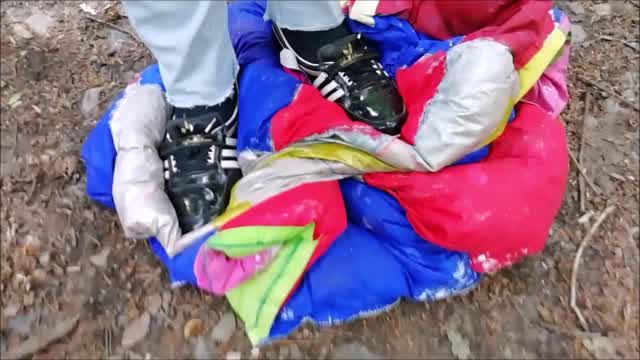 Jana tramples on a duvet with her black Adidas patent ballerinas trailer