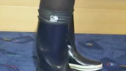 Jana shows her shiny blue rubber boots