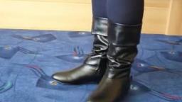 Jana shows her boots black with buckle and gauntlet