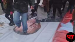 Swedes at a rally in Stockholm use a banner with Erdogans face like a doormat.