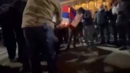 In front of the Georgian parliament in Tbilisi, protesters began burning Russian flags.