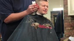 Barber Pranks Kid By Pretending to Cut his ear off.