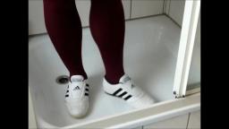 Jana write on squeaks with her Adidas Martial Arts white black and destroy them in shower trailer