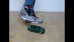 Jana crush a toy car with her Adidas Hardcourt grey black