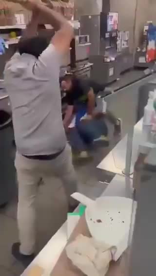 Store owner stands on business against a robber