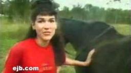 A horse poos on a ladys head