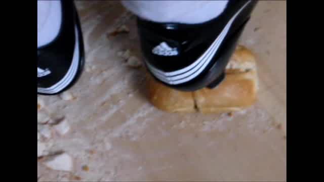 Jana crush bread rolls with her Adidas F10 soccer shoes close up trailer