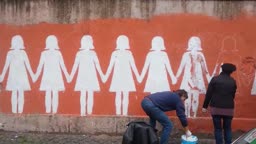 Restoring an anti-femicide mural in Rome, Italy