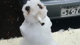 Snow man lights up a cig