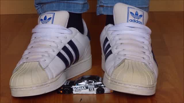 Jana crushes a model car with her Adidas Superstar sneakers trailer