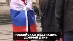 A Russian in Paris took to the streets of the city with the Russian flag