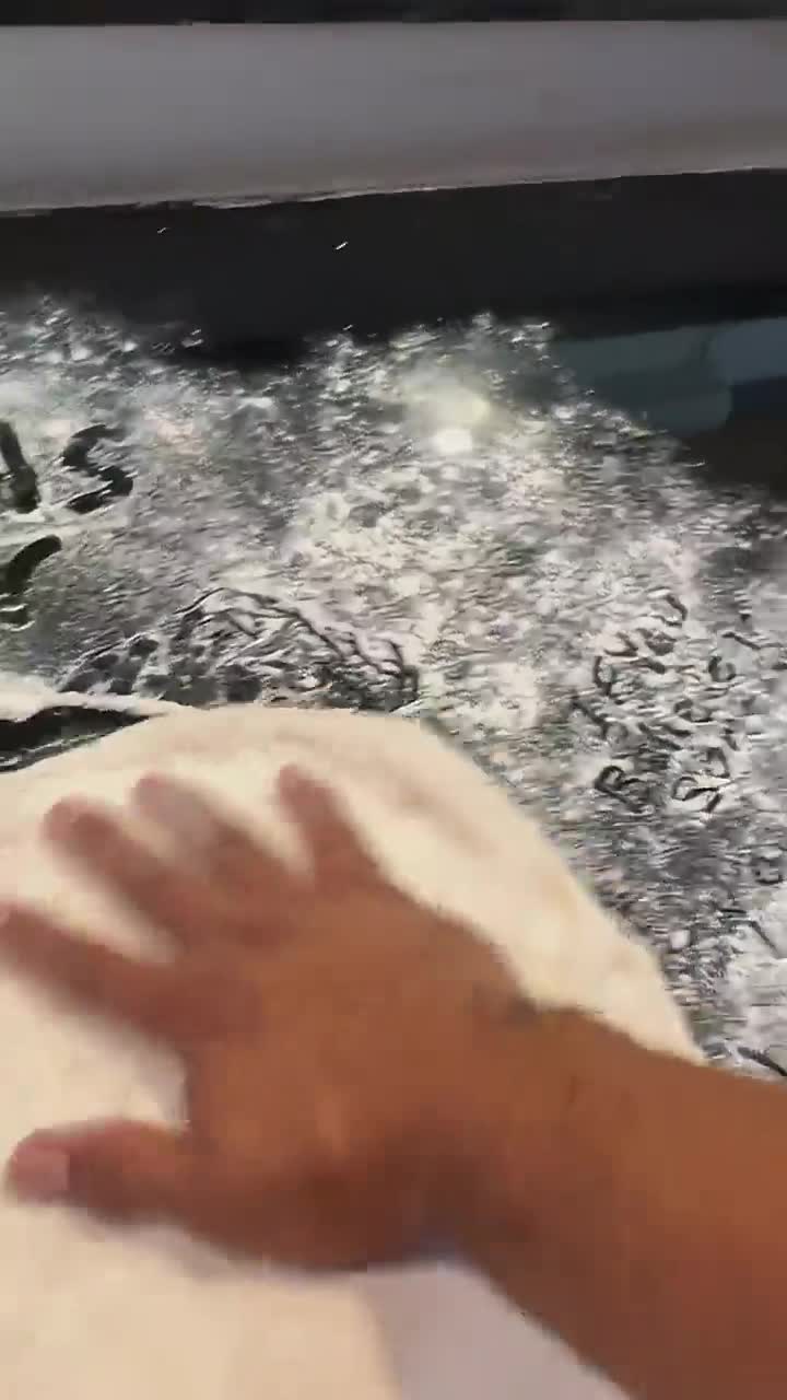 Latinx Vidlii Owner making a pizza Latinx Vidlii Owner making a pizza