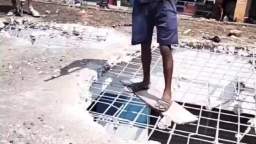 Indian construction workers building a house using only hammer