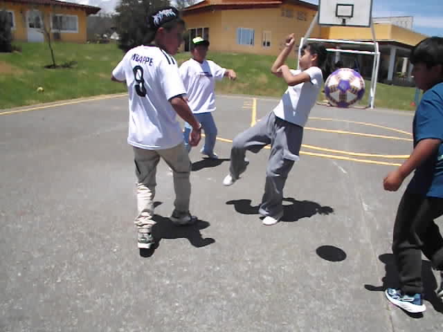 guy throws football out of school