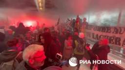 Protesters against pension reform in Paris occupied the building of the LVMH company, burning flares